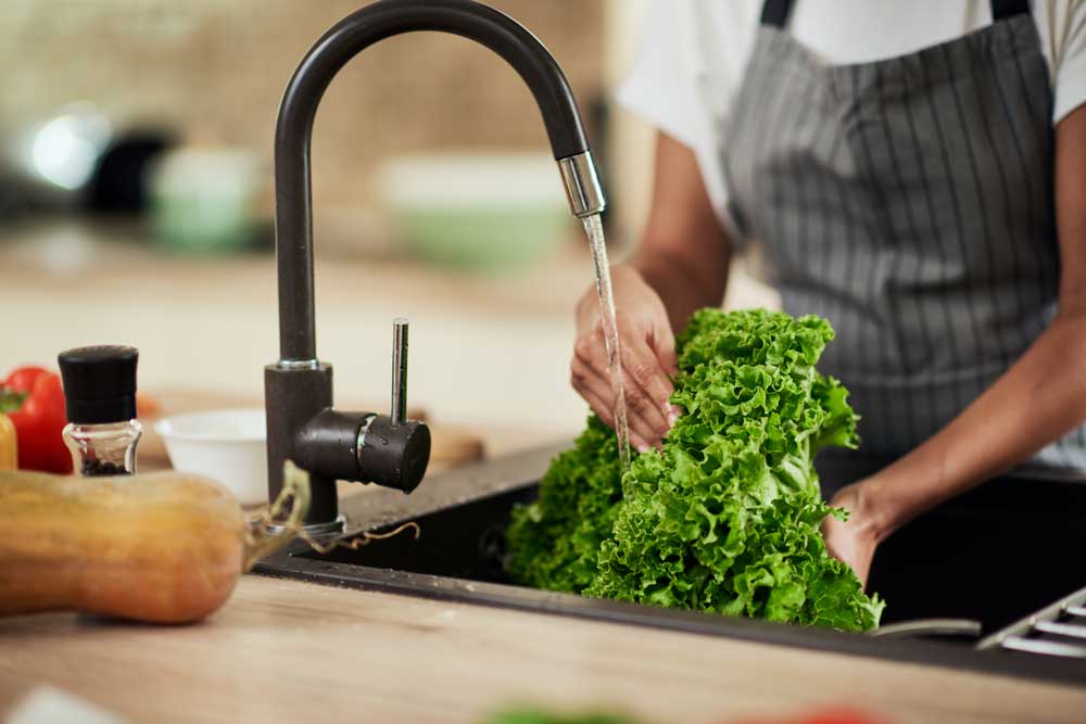 Washing lettuce with cleaner filtered water